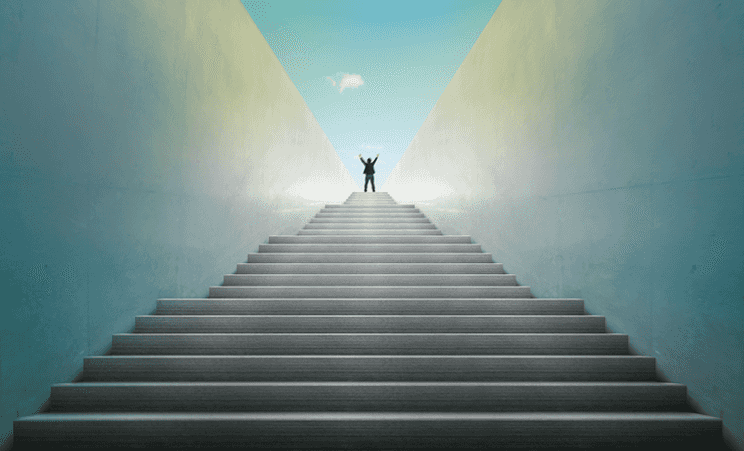 Illustration of a man on top of a long stair case reaching towards the clouds